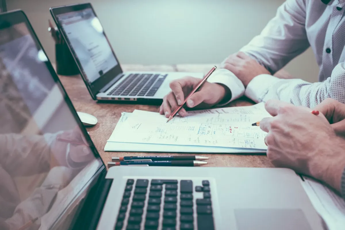 Business consultant in UAE reviewing company setup paperwork with a client